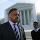 Rev Jesse Jackson Sr stands in front of the U.S. Supreme Court on October 10, 2012 in Washington, DC.